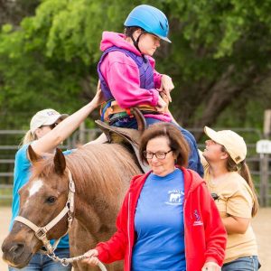 Client on horse in arena