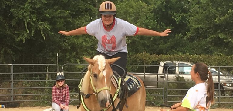 Vaulting - Student kneeling on horse