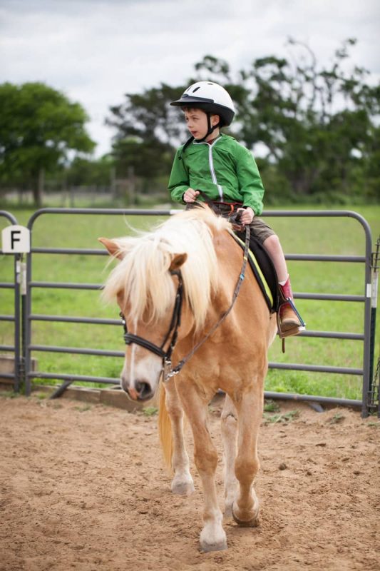 Therapeutic Riding - Child riding a horse